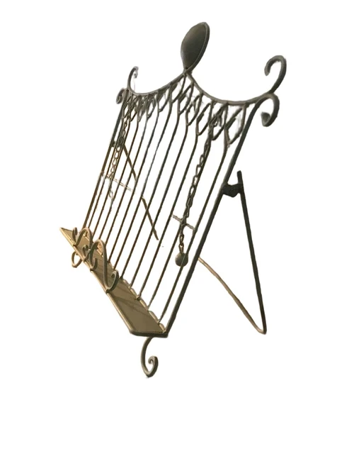 A white stand / holder for pieces of music, menus and, for example, books