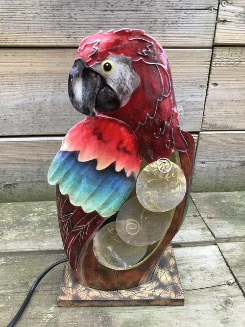 A metal lamp in the shape of a parrot, very beautiful!