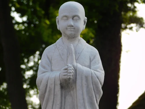 Greeting Monk on Pedestal - Solid Stone