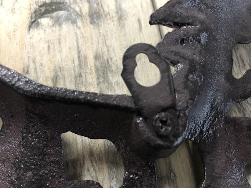 Wall ornament abstract image of a running horse, cast iron brown.