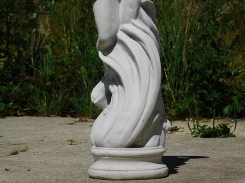 Beautiful, solid white stone sculpture of a standing lady – garden statue