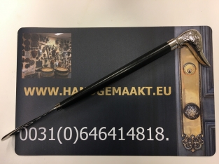 Beautiful nickel hardwood shoehorn with duck head nickel.