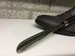 Beautiful nickel hardwood shoehorn with duck head nickel.