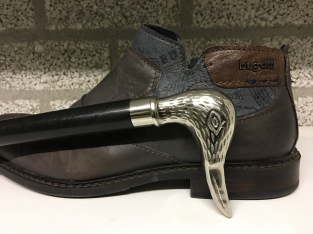 Beautiful nickel hardwood shoehorn with duck head nickel.