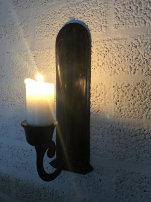 Beautiful dark brown heavy wrought iron wall sconce.