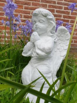 Praying angel, garden statue