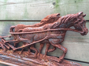 Wall decoration , cast iron fireplace plate farmer with horse and plow.